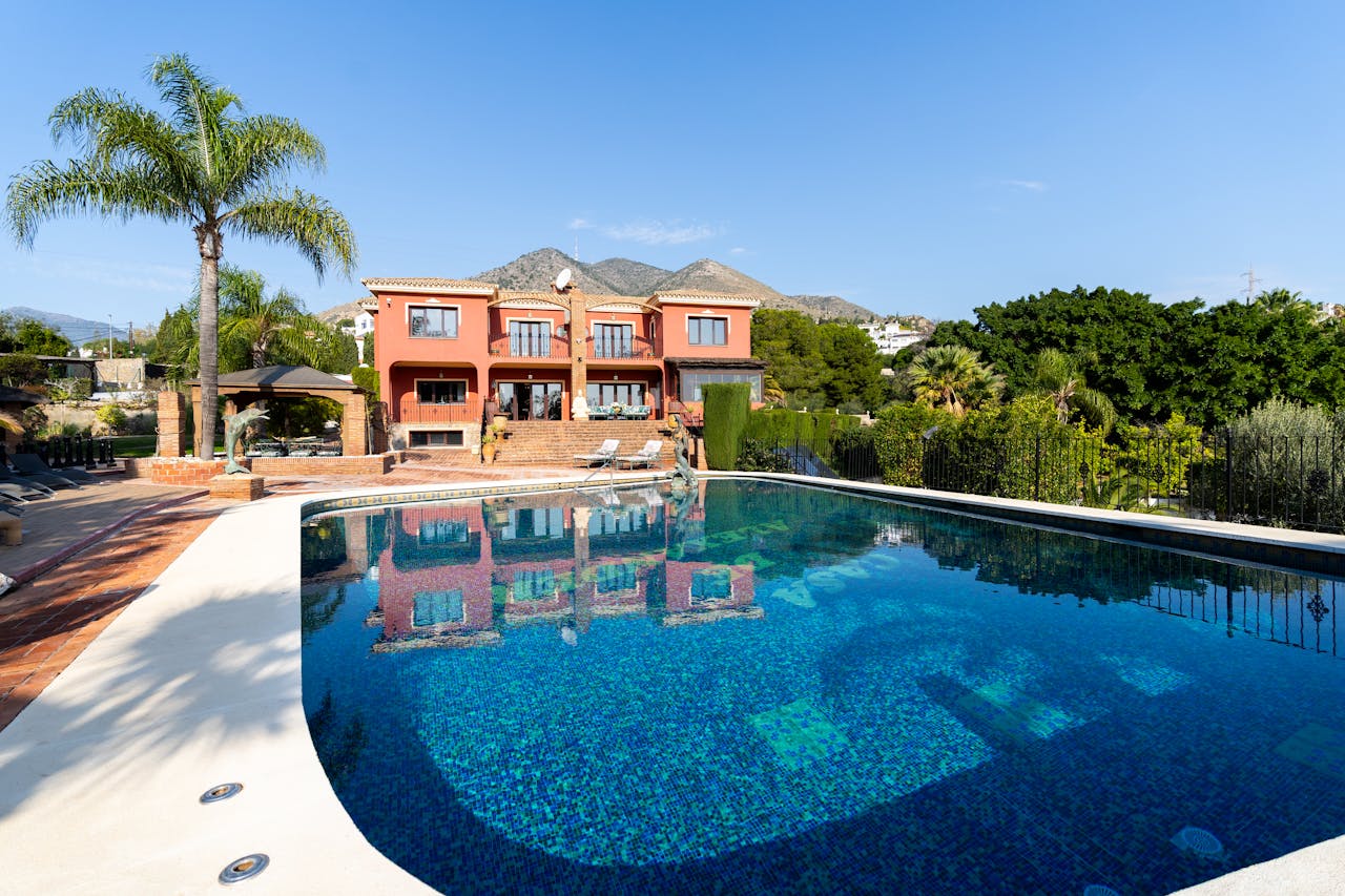 Stunning luxury villa with a swimming pool and mountain view, perfect for travel and lifestyle imagery.